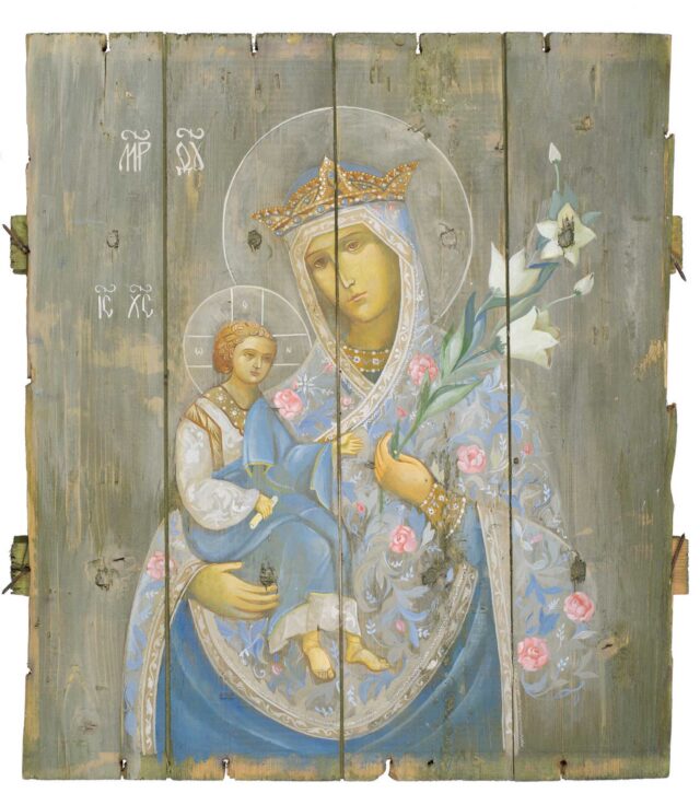 Virgin Mary Of The Eternal Bloom, by Sofia Atlantova | Olexander Klimenko, 2019, Tempera on bottom of ammo box, 51 x 46 cm | 20.4 x 18.4 in. The box was brought from Avdiivka (Industrial Zone) by volunteer doctors of the Mykola Pyrohov FVMH. © Sofia Atlantova | Olexander Klimenko